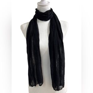 Woman’s black light scarf.